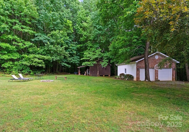 328 Whippoorwill Rd, Mooresville, NC 28117 - view of green lawn with an outbuilding and a garage