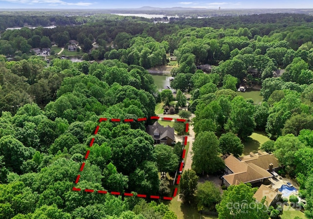 328 Whippoorwill Rd, Mooresville, NC 28117 - aerial view of property and surrounding area with a forest, property parcel outlined, and a nearby body of water