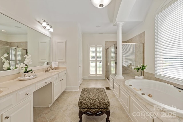 7507 Meadowgate Ln, Waxhaw, NC 28173 - full bathroom featuring decorative columns, healthy amount of natural light, a stall shower, double vanity, and crown molding