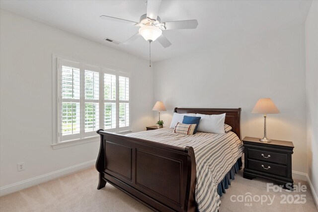 7507 Meadowgate Ln, Waxhaw, NC 28173 - bedroom with light colored carpet, baseboards, and a ceiling fan