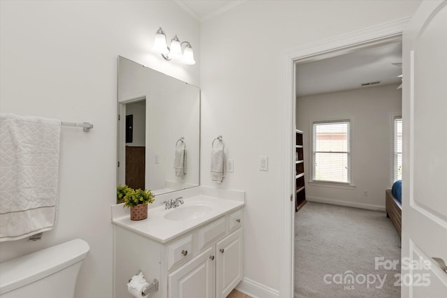 7507 Meadowgate Ln, Waxhaw, NC 28173 - bathroom with toilet, vanity, and baseboards