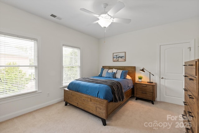 7507 Meadowgate Ln, Waxhaw, NC 28173 - bedroom with light colored carpet, baseboards, and ceiling fan