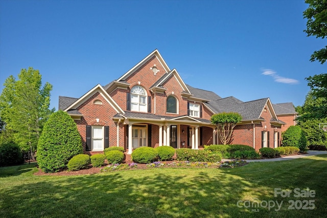 7507 Meadowgate Ln, Waxhaw, NC 28173 - view of front of house featuring brick siding, a front yard, and a porch
