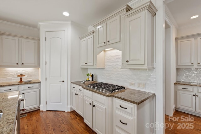 7507 Meadowgate Ln, Waxhaw, NC 28173 - kitchen with decorative backsplash, stainless steel gas stovetop, wood finished floors, stone countertops, and recessed lighting