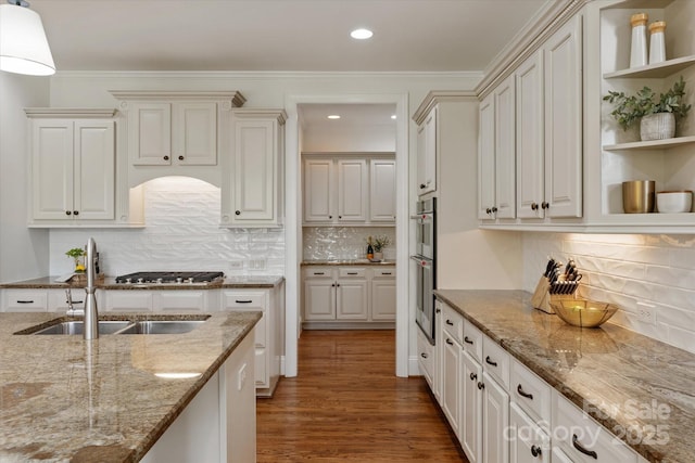 7507 Meadowgate Ln, Waxhaw, NC 28173 - kitchen with a sink, open shelves, wood finished floors, light stone countertops, and recessed lighting