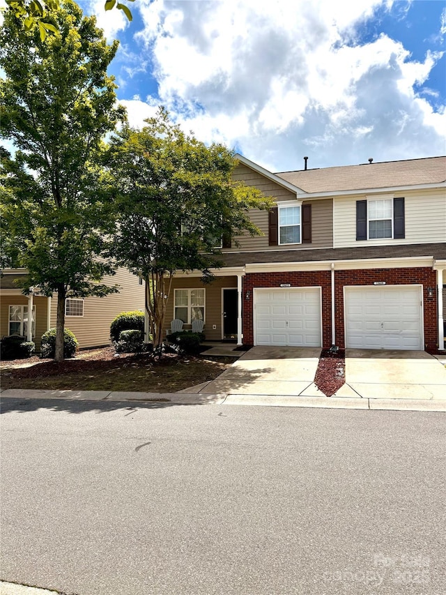 13612 Singleleaf Ln, Charlotte, NC 28278 - multi unit property featuring driveway, a garage, and brick siding