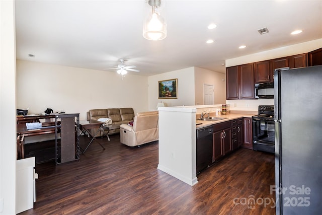 13612 Singleleaf Ln, Charlotte, NC 28278 - kitchen with black appliances, dark wood-type flooring, a peninsula, a sink, and recessed lighting