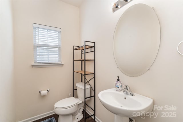 13612 Singleleaf Ln, Charlotte, NC 28278 - bathroom with a sink, toilet, and baseboards