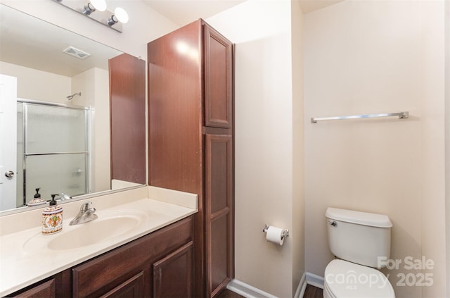 13612 Singleleaf Ln, Charlotte, NC 28278 - bathroom featuring toilet, a shower with shower door, and vanity