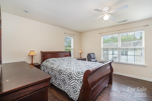 13612 Singleleaf Ln, Charlotte, NC 28278 - bedroom featuring dark wood-style floors, multiple windows, baseboards, and ceiling fan