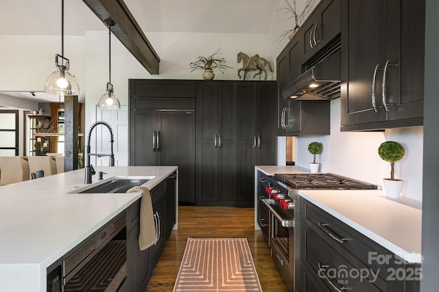 5 Saddle Rdg, Fletcher, NC 28732 - kitchen featuring high end range, under cabinet range hood, dark wood-style flooring, light countertops, and hanging light fixtures