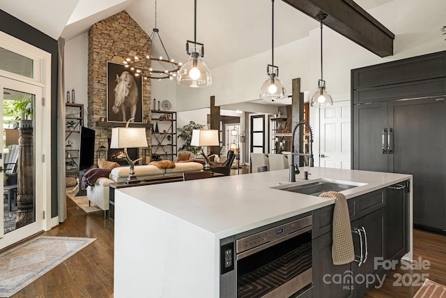 5 Saddle Rdg, Fletcher, NC 28732 - kitchen with built in appliances, dark wood finished floors, light countertops, high vaulted ceiling, and decorative light fixtures
