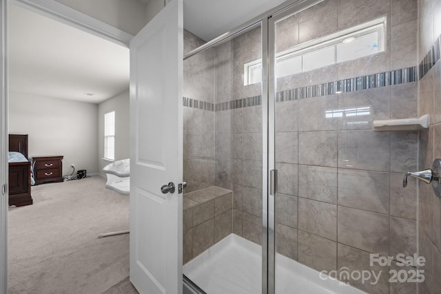 ensuite bathroom with a shower stall