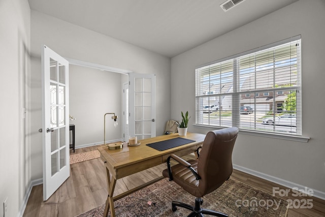 office featuring french doors, baseboards, and wood finished floors