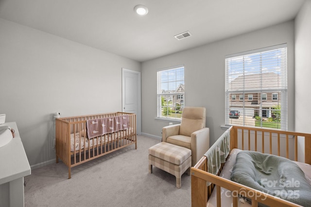 carpeted bedroom with baseboards