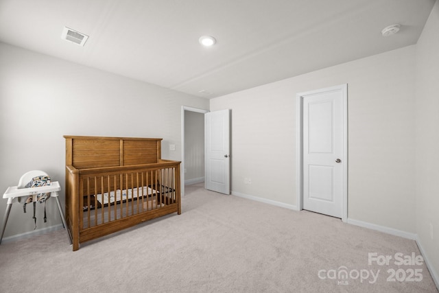 bedroom with carpet flooring and baseboards