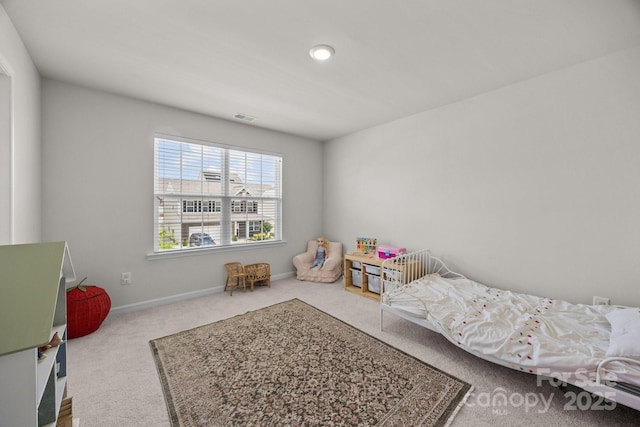 carpeted bedroom with baseboards