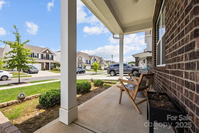 view of patio with a porch and a residential view