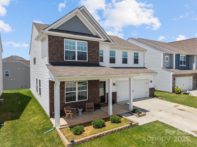 view of front of property with brick siding, board and batten siding, concrete driveway, a garage, and a front lawn