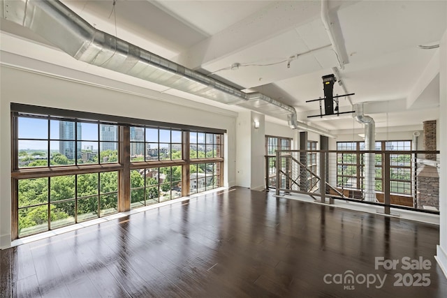 garage featuring baseboards and french doors