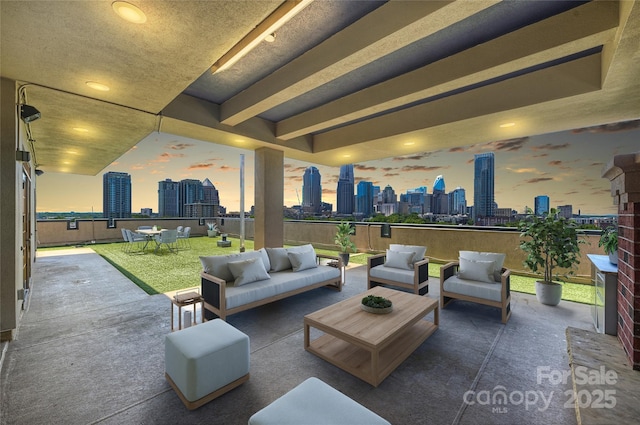 view of patio / terrace featuring a view of skyline and outdoor lounge area