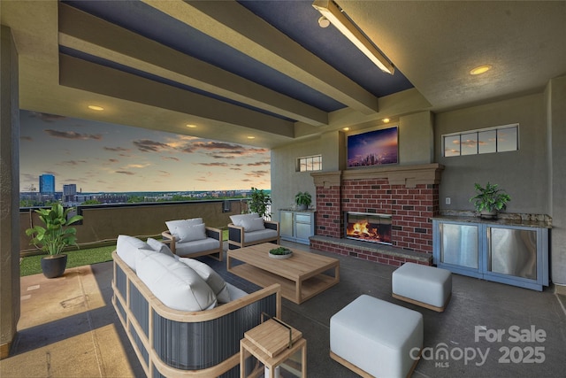 view of patio with an outdoor living space with a fireplace