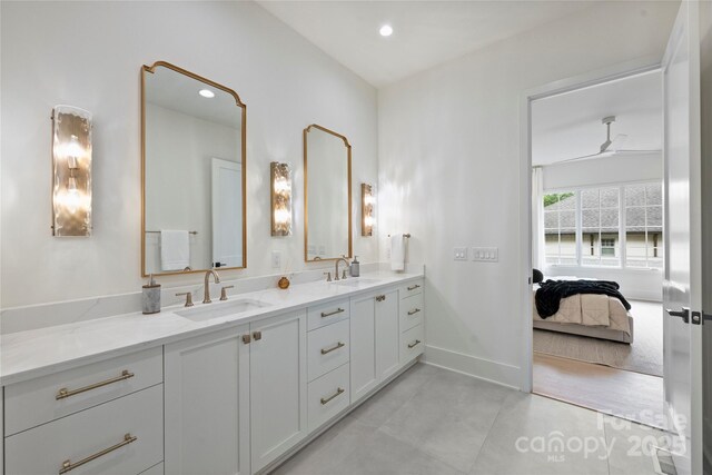 536 Hillside Ave, Charlotte, NC 28209 - ensuite bathroom featuring double vanity, recessed lighting, and baseboards
