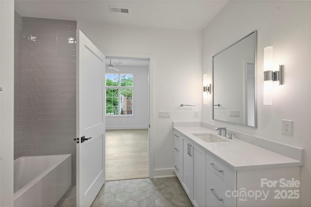 536 Hillside Ave, Charlotte, NC 28209 - bathroom with vanity, tile patterned flooring, a bathtub, a ceiling fan, and a shower