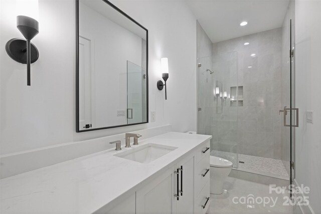 536 Hillside Ave, Charlotte, NC 28209 - bathroom featuring a stall shower, toilet, vanity, and recessed lighting
