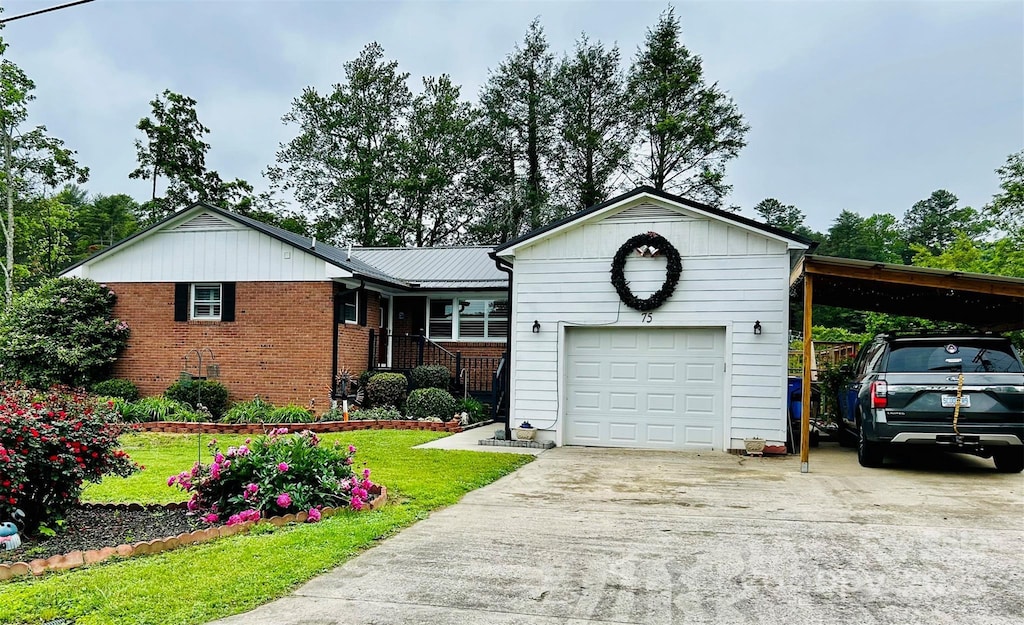 ranch-style house featuring concrete driveway, brick siding, a front yard, and a garage