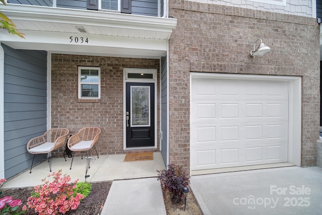 5034 Moss Pine Way, Tega Cay, SC 29708 - entrance to property with brick siding and a garage