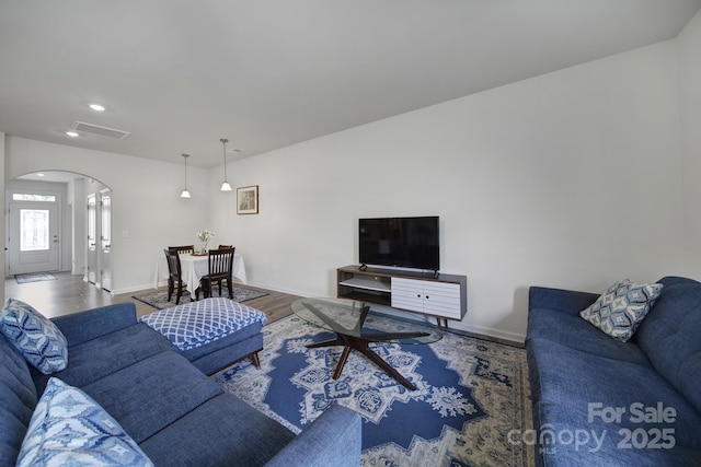 5034 Moss Pine Way, Tega Cay, SC 29708 - living room with arched walkways, wood finished floors, baseboards, and recessed lighting
