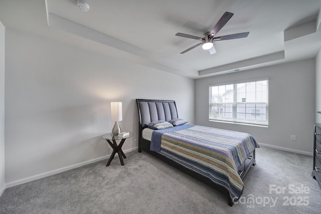 5034 Moss Pine Way, Tega Cay, SC 29708 - bedroom featuring light carpet, a raised ceiling, baseboards, and ceiling fan