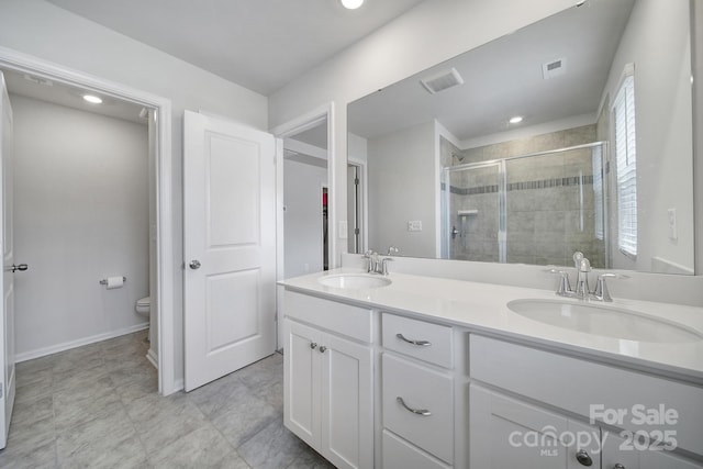 5034 Moss Pine Way, Tega Cay, SC 29708 - bathroom with a stall shower, toilet, double vanity, baseboards, and recessed lighting