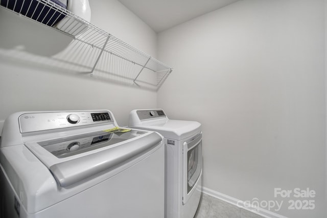 5034 Moss Pine Way, Tega Cay, SC 29708 - clothes washing area with washer and dryer, baseboards, and light tile patterned floors