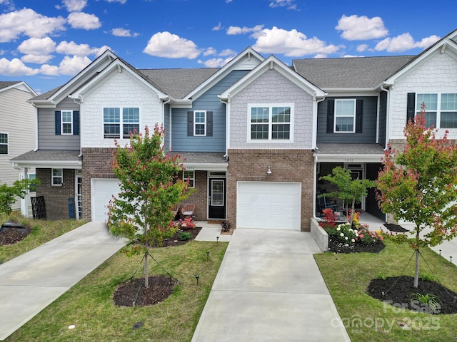 5034 Moss Pine Way, Tega Cay, SC 29708 - view of front of home featuring concrete driveway, brick siding, a garage, and a front lawn