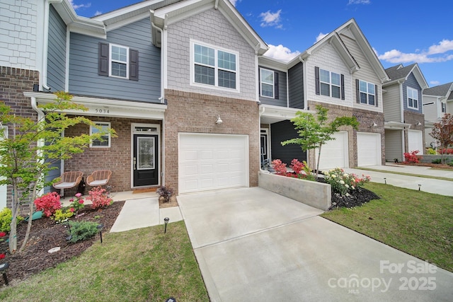 5034 Moss Pine Way, Tega Cay, SC 29708 - view of property with an attached garage, concrete driveway, and brick siding