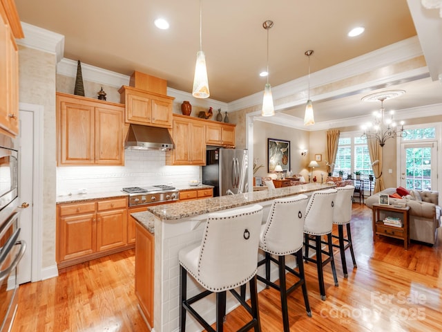 3044 Luke Crossing Dr, Charlotte, NC 28226 - kitchen featuring appliances with stainless steel finishes, range hood, crown molding, light wood-style floors, and a breakfast bar area