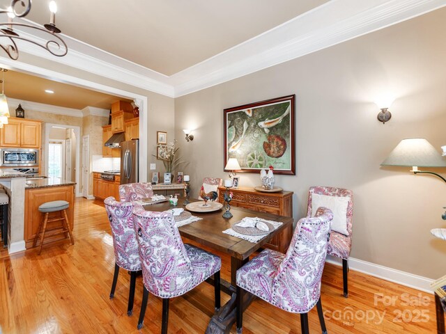 3044 Luke Crossing Dr, Charlotte, NC 28226 - dining space with crown molding and light wood finished floors