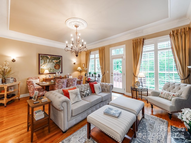 3044 Luke Crossing Dr, Charlotte, NC 28226 - living area with a chandelier, ornamental molding, a tray ceiling, and light wood finished floors