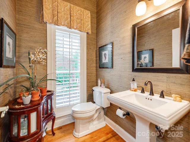 3044 Luke Crossing Dr, Charlotte, NC 28226 - bathroom with toilet, wood finished floors, a sink, and baseboards