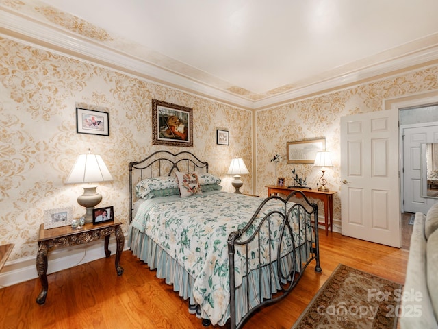3044 Luke Crossing Dr, Charlotte, NC 28226 - bedroom featuring wood finished floors, wallpapered walls, crown molding, and baseboards