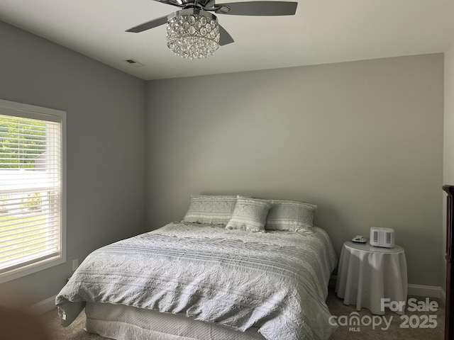 1119 Balls Creek Rd, Claremont, NC 28610 - bedroom featuring carpet flooring, baseboards, and ceiling fan