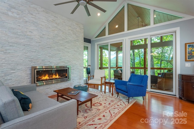 201 Ruffed Grouse Ln, Waynesville, NC 28786 - living area with healthy amount of natural light, ceiling fan, wood finished floors, a fireplace, and high vaulted ceiling