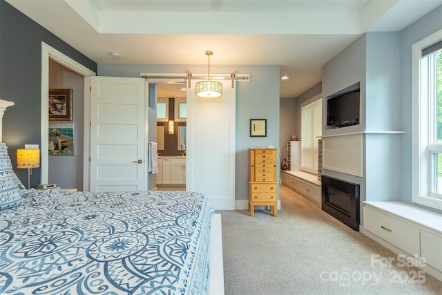 201 Ruffed Grouse Ln, Waynesville, NC 28786 - bedroom with light colored carpet and a glass covered fireplace