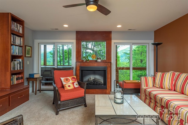 201 Ruffed Grouse Ln, Waynesville, NC 28786 - living area with plenty of natural light, a glass covered fireplace, ceiling fan, recessed lighting, and carpet flooring