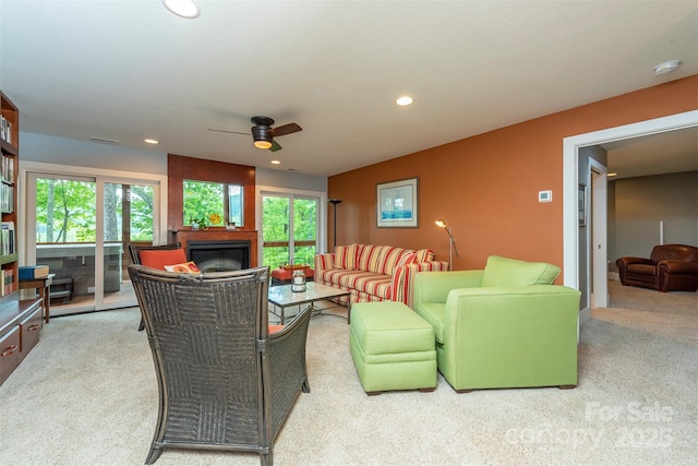 201 Ruffed Grouse Ln, Waynesville, NC 28786 - carpeted living room featuring a glass covered fireplace, ceiling fan, and recessed lighting