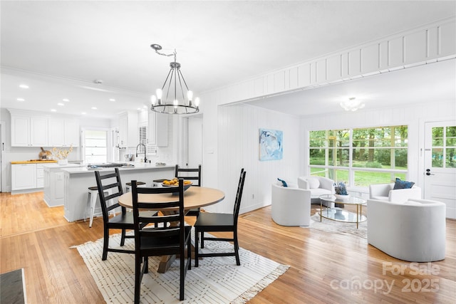 5162 Lincrest Pl, Charlotte, NC 28211 - dining area with a chandelier, healthy amount of natural light, light wood-style floors, ornamental molding, and recessed lighting