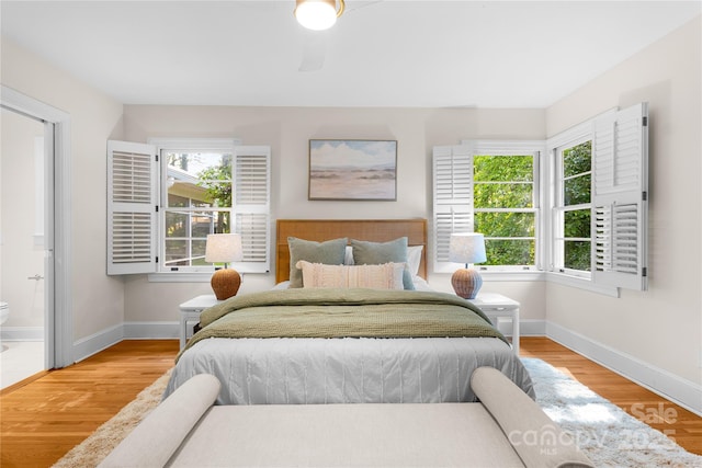 5162 Lincrest Pl, Charlotte, NC 28211 - bedroom with baseboards, wood finished floors, and ensuite bath