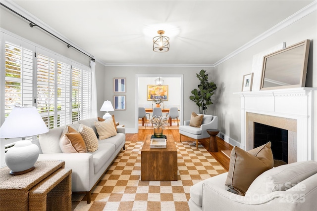 5162 Lincrest Pl, Charlotte, NC 28211 - living area with ornamental molding, a fireplace, light wood finished floors, and baseboards